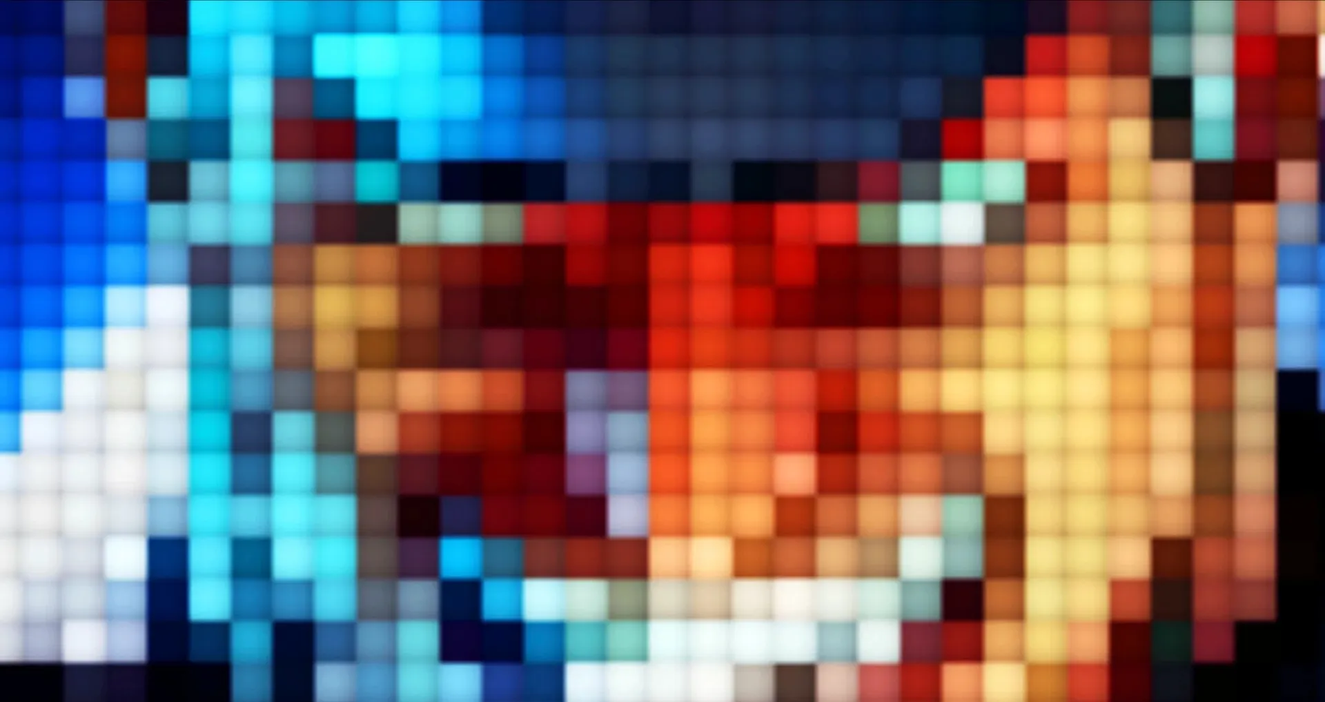 A close-up of glowing mosaic pixels in electric blue, red and gold.